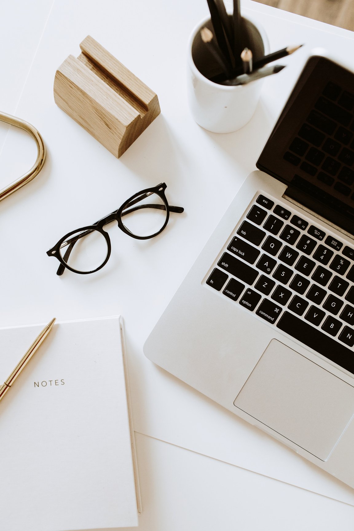 Contemporary Minimalist Office Desk with Laptop and Notebook Flatlay